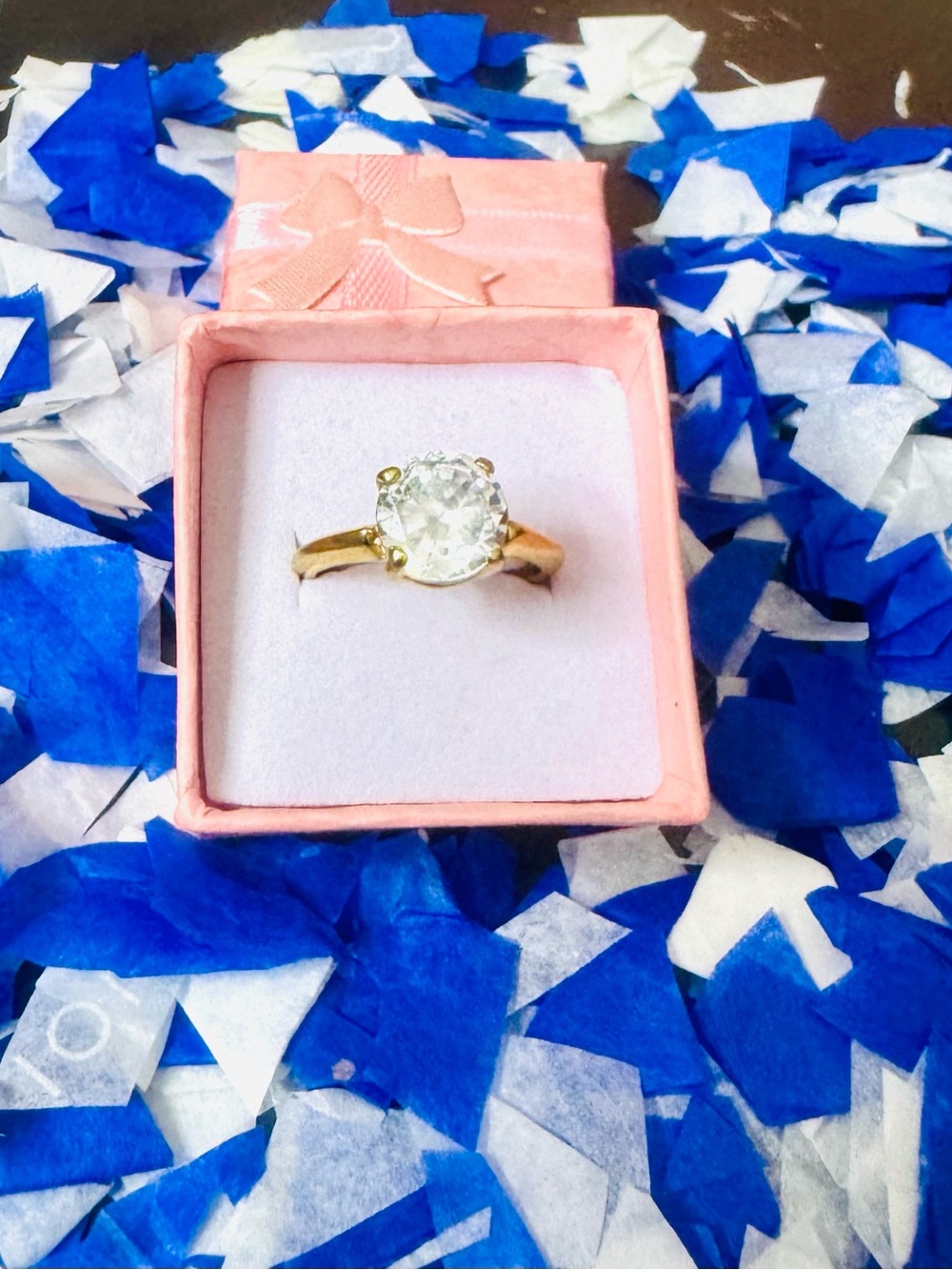 Elegant Gold Solitaire Ring with Clear Stone in Pink Box